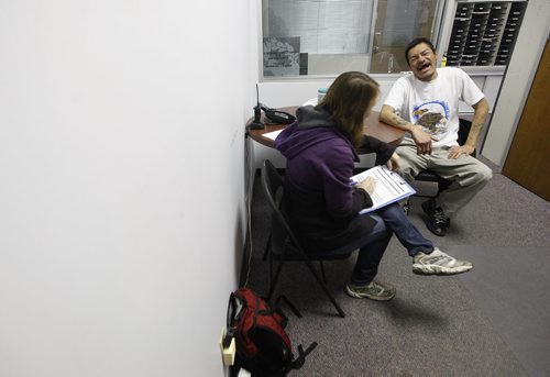 October 25, 2015 - 151025  -  Dougie laughs as he tells a story to a homeless census volunteer at Main Street Project Sunday, October 25, 2015. A census is being taken of Winnipeg's homeless population. John Woods / Winnipeg Free Press