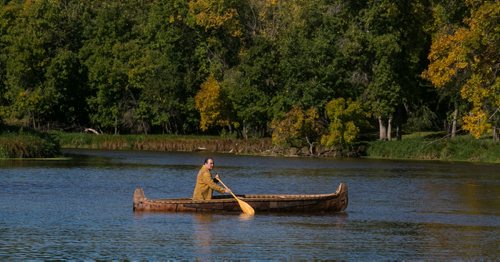 Kevin Brownlee, curator of archeology at Manitoba Museum, in the birch bark canoe he made with his wife after they got married. The canoe was a gift from fellow archeologists. 150921 - Wednesday, September 23, 2015 -  MIKE DEAL / WINNIPEG FREE PRESS