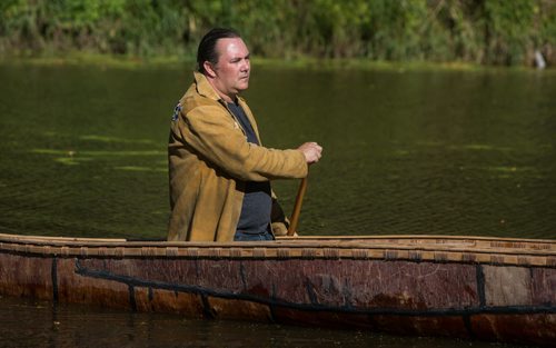 Kevin Brownlee, curator of archeology at Manitoba Museum, in the birch bark canoe he made with his wife after they got married. The canoe was a gift from fellow archeologists. 150921 - Wednesday, September 23, 2015 -  MIKE DEAL / WINNIPEG FREE PRESS