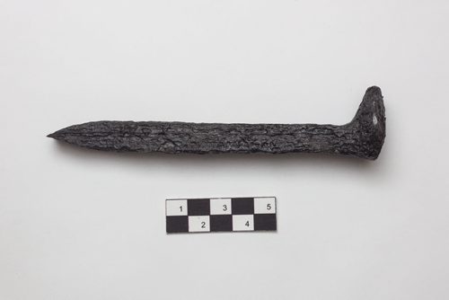 Scott Stephen, an historian at Parks Canada, showcases a few artifacts in the collections at the Parks Canada office in Winnipeg that were recovered from various digs at the forks and area. Railway Spike (21K32G1-2): This spike was recovered from North Point in the railway fill during the 1988 field season.  Railway spikes were used to fasten the track to the wooden ties. They were driven parallel to the track and across the tie grain for a stronger hold. This iron spike has an L-shaped head, square shank tapered to a chisel point which indicates it was made by being  drawn from a square bar stock.  This spikes waxy appearance is attributed to the microcrystalline wax applied to conserve the metal by protecting it from the moisture in the environment. 150924 - Thursday, September 24, 2015 -  MIKE DEAL / WINNIPEG FREE PRESS