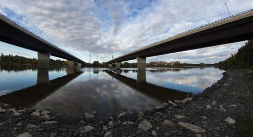 The Red River flows underneath the spans of the Bishop Grandin bridge. 150923 - Wednesday, September 23, 2015 -  MIKE DEAL / WINNIPEG FREE PRESS