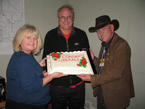 Canstar Community News (From left) Susan Paulus, Don Paulus and Gary Enns, volunteers on MaryAnn Mihychuk's victorious Kildonan-St. Paul campaign show off a celebratory cake.