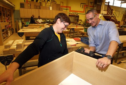 The province is launching an apprenticeship program to encourage women to get into the trades. Student named Aubrey Doerksen and Kevin Chief, Minister of Jobs and the Economy do some cabinet building in the Notre Dame campus woodshop. BORIS MINKEVICH / WINNIPEG FREE PRESS  OCT 27, 2015