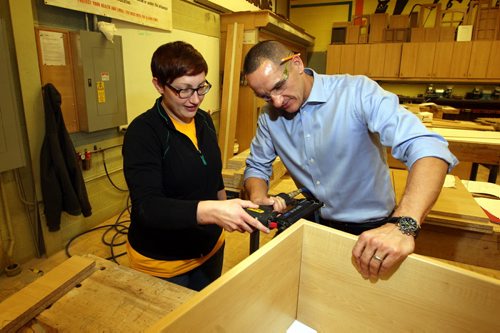 The province is launching an apprenticeship program to encourage women to get into the trades. Student named Aubrey Doerksen and Kevin Chief, Minister of Jobs and the Economy  do some cabinet building in the Notre Dame campus woodshop. BORIS MINKEVICH / WINNIPEG FREE PRESS  OCT 27, 2015