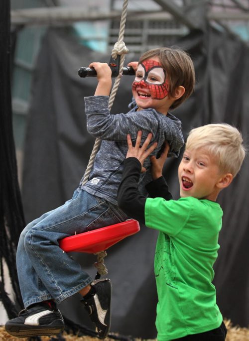 Brothers Connor Nichols -7yrs (green) and  Hayden Nichols 4yrs,  give each other a push while playing in the Halloween Fun Zone at Shelmerdines Tuesday which is open daily till Oct 31/15 Standup photo   Oct 27, 2015 Ruth Bonneville / Winnipeg Free Press