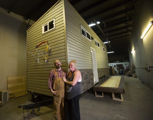 Mini House of Manitoba co-founders Darrell Manuliak and Anita Munn proudly stand by a 242-square-foot house that they built in one month for a client in Winnipeg on Wednesday, Oct. 28, 2015.   (Mikaela MacKenzie/Winnipeg Free Press)