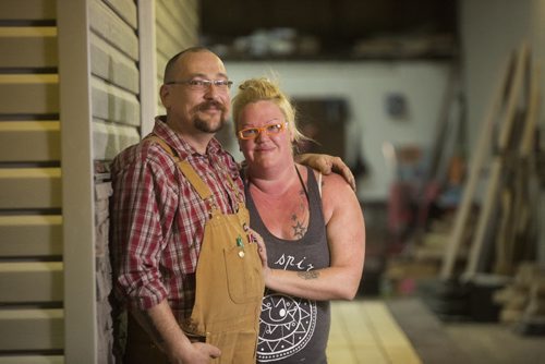 Mini House of Manitoba co-founders Darrell Manuliak and Anita Munn proudly stand by a 242-square-foot house that they built in one month for a client in Winnipeg on Wednesday, Oct. 28, 2015.   (Mikaela MacKenzie/Winnipeg Free Press)