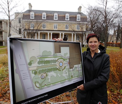 Archdiocese of Saint Boniface transforms empty lawn into memorial garden for nuns, other church heroes, and pioneers in province, corner of Tache and Cathedral. Julie Turenne-Maynard poses for a photo with the plans on the grounds. BORIS MINKEVICH / WINNIPEG FREE PRESS  OCT 28, 2015