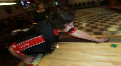 Wendy Popke delivers at the John Osborne ANAF Legion Wednesday night. The shuffleboarders at the legion hosted the National Championships three weeks ago. See Dave Sanderson's story.  October 28, 2015 - (Phil Hossack / Winnipeg Free Press)