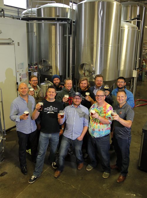 Craft beer makers met today to discuss the future of their business at Half Pints Brewing Company. Here they are posing with the brewery in behind. BORIS MINKEVICH / WINNIPEG FREE PRESS  OCT 29, 2015