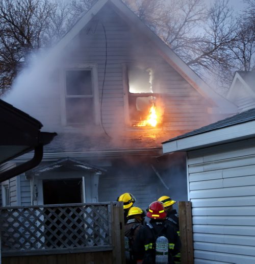 Winnipeg Fire Fighters battle a fire at the back of a house in the 1100 block of Manitoba Ave. No one was in the house when crews arrived and no injuries. The cause is under investigation. Wayne Glowacki / Winnipeg Free Press October 30  2015