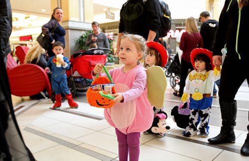 Kids dressed up in costumes eagerly wait in line for goodies at Kildonan Place Mall Friday afternoon for their annual Trick or treating at the mall event.   Standup photo Oct 29, 2015 Ruth Bonneville / Winnipeg Free Press