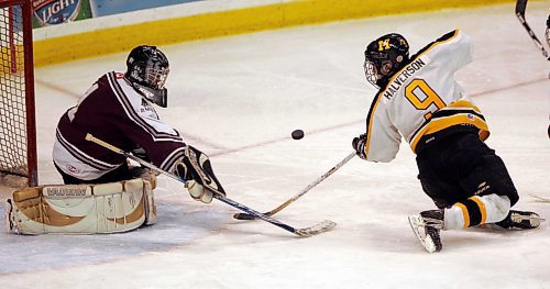 BORIS MINKEVICH / WINNIPEG FREE PRESS  080113 St. Paul's goalie Brent Wolfe makes a save against Fort Frances Muskies #9 George Halverson.