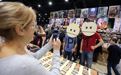 Marcia Kroeker of Bit By Bit Designs snaps a photo of Jarred Voth  (left) and Kris Orlow as characters Phillip and Terrance from South Park at Central Canada Comic Con at RBC Convention Centre Winnipeg on Oct. 31, 2015. Photo by Jason Halstead/Winnipeg Free Press