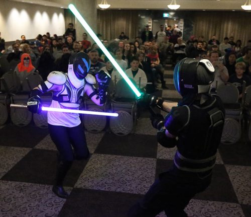 Winona Casavant (left) and Tim Webster of River City Jedi martial arts school take part in a light sabre duel at Central Canada Comic Con at RBC Convention Centre Winnipeg on Oct. 31, 2015. Photo by Jason Halstead/Winnipeg Free Press