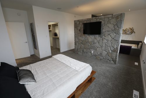 Homes. 37 Big Sky Drive in Oak Bluff West. The master bedroom with rock divider between shower/bath area. Artista Homes sales is rep Jennifer Gulay. Wayne Glowacki / Winnipeg Free Press Nov. 2  2015
