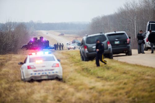 Police block Lambert road at Highway 59 in their search for a potential suspect near St. Malo on Monday, Nov. 2, 2015.   (Mikaela MacKenzie/Winnipeg Free Press)