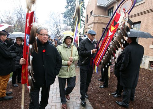 Grand opening of the National Research Centre for Truth and Reconciliation, Chancellors Hall, 177 Dysart Road, University of Manitoba. Phil Fontaine helps lead the group to University Centre where event continues throughout the afternoon. (in light coloured jacket) BORIS MINKEVICH / WINNIPEG FREE PRESS  NOV 3, 2015