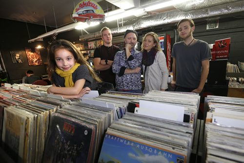 November 3, 2015 - 151103 - Malaya Cueto, 6, Jordan Sawchuck, manager, Darren Sawchuck, Loralie McKelvey, record spinner, and Seamus McKelvey photographed inside Vinyl Revival Tuesday, November 3, 2015. Darren Sawchuk, a defense lawyer by day who, a few weeks ago, opened Vinyl Revival, a used record store, school, cafe, and open stage in the old Tredwell's Music Store.  John Woods / Winnipeg Free Press