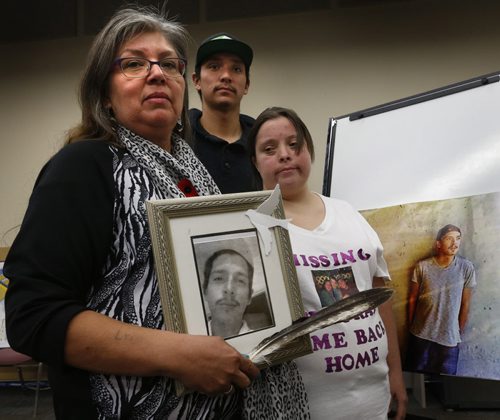 Lydia Daniels holds a photograph of her missing son Colten Pratt beside her son Catlin Daniels and daughter Jocelyn Pratt Thursday. Lydia wakes up every day hoping for a break in the case, but to date theres been no  trace of Pratt, a 26-year-old who disappeared shortly after he moved to Winnipeg looking for work last year.  Katie May story Wayne Glowacki / Winnipeg Free Press Nov. 5   2015