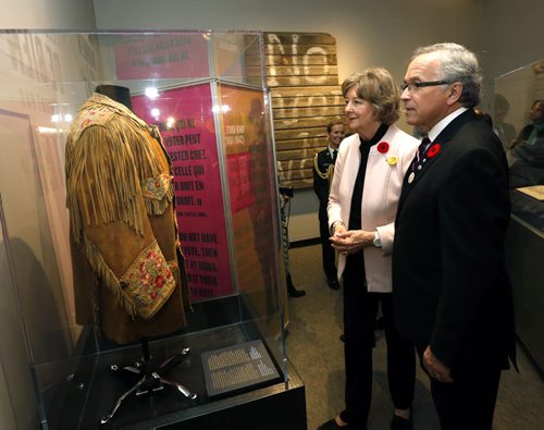 Lt. Gov. Janice Filmon and Gary Filmon look at E. Cora Hind's famous moose hide jacket on display at the "Nice Women Don't Want the Vote" exhibit at the Manitoba Museum that opened Thursday. Jen Zoratti story Wayne Glowacki / Winnipeg Free Press Nov. 5   2015