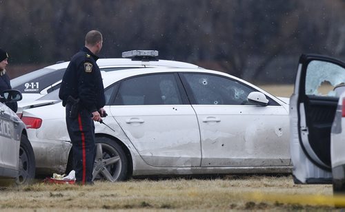 Police Officers at a scene at Kenaston and Grant Ave. where a man was wielding a gun around causing police officers to shoot at him.  More details to come.    Wayne Glowacki / Winnipeg Free Press Nov. 6   2015