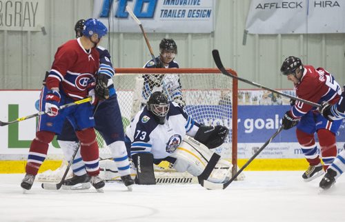 Goalie Shawn Daniels makes a save as CN's hockey team challenges Canadiens alumni in a special game at the MTS Iceplex in Winnipeg on Saturday, Nov. 7, 2015.   (Mikaela MacKenzie/Winnipeg Free Press)