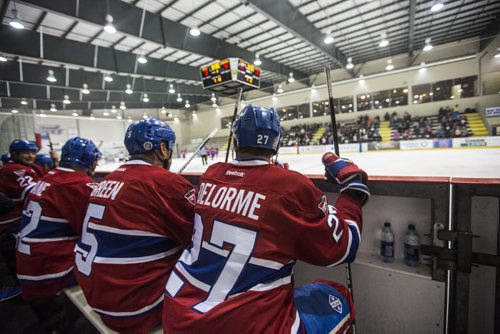 Players watch from the bench as CN's hockey team challenges Canadiens alumni in a special game at the MTS Iceplex in Winnipeg on Saturday, Nov. 7, 2015.   (Mikaela MacKenzie/Winnipeg Free Press)