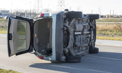 DAVID LIPNOWSKI / WINNIPEG FREE PRESS 151107  A two-vehicle collision that left one on its side is tying up traffic on Taylor Ave at the Walmart parking lot early Saturday November 7, 2015.