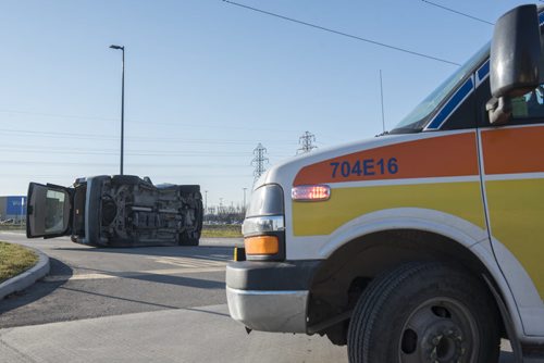 DAVID LIPNOWSKI / WINNIPEG FREE PRESS 151107  A two-vehicle collision that left one on its side is tying up traffic on Taylor Ave at the Walmart parking lot early Saturday November 7, 2015.