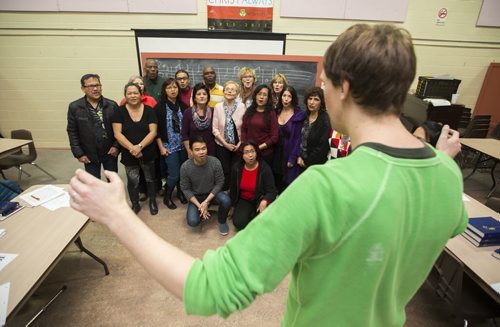 Ian Campbell directs singers as they pose for a photo at a singing class at St. Mary's Cathedral in Winnipeg on Saturday, Nov. 7, 2015.   (Mikaela MacKenzie/Winnipeg Free Press)