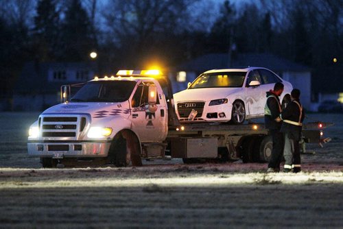 November 8, 2015 - 151108  -  Police remove Mark DiCesare's car from a playing field at the corner of Grant Avenue and Kentaston Boulevard Sunday, November 8, 2015. Mark DiCesare was shot and killed by police Friday, November 6, after a chase through a nearby neighbourhood. John Woods / Winnipeg Free Press