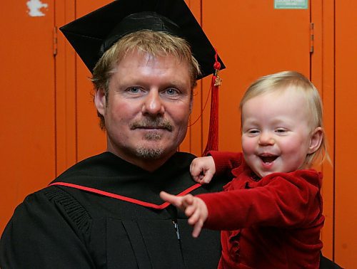 BORIS MINKEVICH / WINNIPEG FREE PRESS  080116 RRC Building construction tech grad Colin McNeill poses for a photo with his 13month old daughter Ellowin.