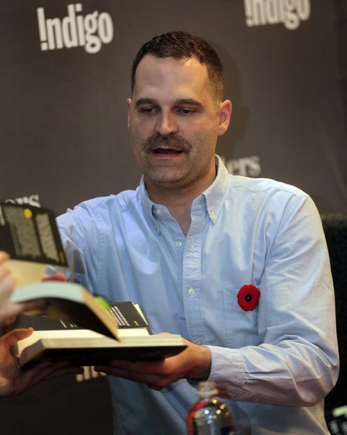Jay Onrait loads up on books to sign at Polo Park Chapters Monday. The Fox sportscaster was at the local book store to autograph copies of his second Book. See Geoff Kirbyson story. November9, 2015 - (Phil Hossack / Winnipeg Free Press)