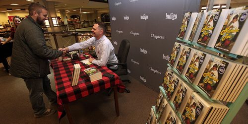 Jay Onrait chats with and signs signs copies of "Number Two" for fans at Polo Park Chapters Monday. The Fox sportscaster was at the local book store to autograph copies of his second book. See Geoff Kirbyson story. November9, 2015 - (Phil Hossack / Winnipeg Free Press)