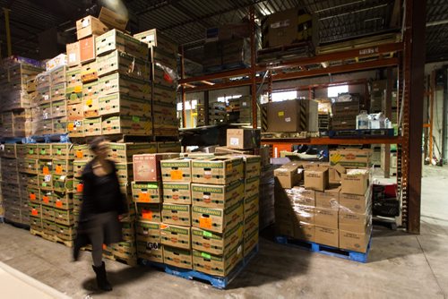 Volunteers work amongst the pallets of food in the warehouse at Winnipeg Harvest. For the Winnipeg Harvest 30th anniversary project.  151110 - Tuesday, November 10, 2015 -  MIKE DEAL / WINNIPEG FREE PRESS