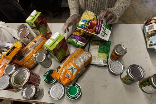 Volunteers work amongst the pallets of food in the warehouse at Winnipeg Harvest. For the Winnipeg Harvest 30th anniversary project.  151110 - Tuesday, November 10, 2015 -  MIKE DEAL / WINNIPEG FREE PRESS