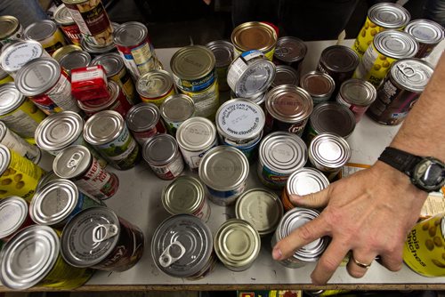 Volunteers work amongst the pallets of food in the warehouse at Winnipeg Harvest. For the Winnipeg Harvest 30th anniversary project.  151110 - Tuesday, November 10, 2015 -  MIKE DEAL / WINNIPEG FREE PRESS