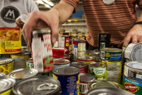 Volunteers work amongst the pallets of food in the warehouse at Winnipeg Harvest. For the Winnipeg Harvest 30th anniversary project.  151110 - Tuesday, November 10, 2015 -  MIKE DEAL / WINNIPEG FREE PRESS