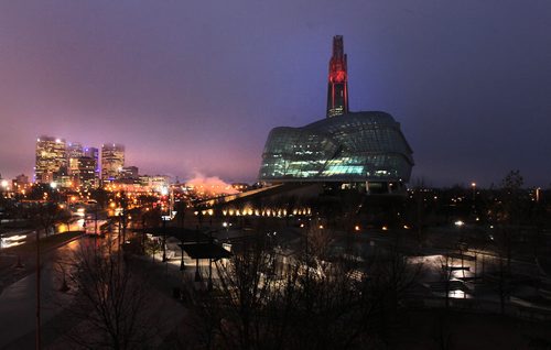The Israel Asper Tower of Hope atop the Canadian Museum for Human Rights glows "poppy red" Tuesday evening, honoring all of Canada's veterans through till after Remeberance Day ceremonies at noon tomorrow. See release. November 10, 2015 - (Phil Hossack / Winnipeg Free Press)