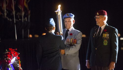 The ceremonial passing of the torch on Remembrance Day at the RBC Convention Centre in Winnipeg on Wednesday, Nov. 11, 2015.   (Mikaela MacKenzie/Winnipeg Free Press)