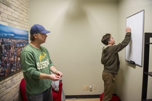 DAVID LIPNOWSKI / WINNIPEG FREE PRESS 151111  Winnipeg Free Press reporter Geoff Kirbyson and son Alex try to make their way out of the Epic Escape on November 11, 2015.  For entertainment story.