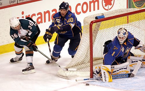 BORIS MINKEVICH / WINNIPEG FREE PRESS 080117 Moose #36 Shaun Heshka tries to jam the puck past Peoria Rivermen goalie #1 Hannu Toivonen. #20 in photo is Aaron MacKenzie.