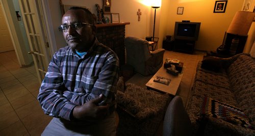 Gobena Loke poses in the living room of a temporary residence for refugees THursday. See Carol Sanders story re Refugee medical aid......November 12, 2015 - (Phil Hossack / Winnipeg Free Press)
