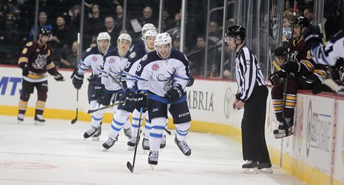 Winnipeg Moose #19 Chase De Leo parades his linemates past the CHicago bench to celebrate the first Moose goal against the Chcago Wolves Thursday evening. See story. November 12, 2015 - (Phil Hossack / Winnipeg Free Press)