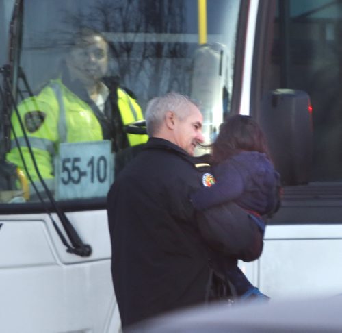 Winnipeg Fire Paramedic with a toddler after a pedestrian was struck on St. Mary's Rd. at Vivian Ave. Friday morning. All south bound lanes were closed. Wayne Glowacki / Winnipeg Free Press Nov. 13   2015