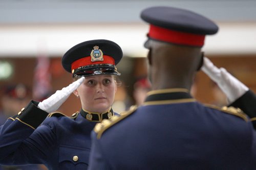 Constable Amanda McGowan salutes Winnipeg Police Chief Devon Clunis as she receives her graduation papers from Recruit Class #158 Friday afternoon at Minto Armoury  There were 21 new graduates from Recruit Class #158 and #158 Lateral-Nov 13, 2015   (JOE BRYKSA / WINNIPEG FREE PRESS)