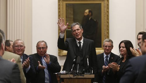 Brian Pallister, leader of the official opposition waves to supporters after he gave his alternative throne speech to outline PC values and priorities Friday. He is in front of a portrait of former Premier H.J. Clarke 1871-1874. Larry Kusch story  Wayne Glowacki / Winnipeg Free Press Nov. 13   2015