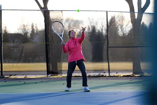 Naomi Gerrard plays tennis with her husband Jon Friday afternoon at Tuxedo Tennis club after the club decided to keep one of the nets up due to the mild weather.  The club plans on setting back up another net for the weekend because of the continuing warm weather.   Standup photo  Nov 13, 2015 Ruth Bonneville / Winnipeg Free Press