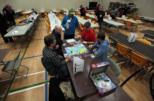 Earlybird Tabletop game players set-up inside the gymnasium at the Bronx Park Community Centre for the fifth annual JimCon as the doors opened around 530 Friday.. More than 500 individuals are expected to attend JimCon, Winnipegs tabletop games convention, this weekend. Attendees will be playing a variety of board, card, miniature and role-playing games. There are more than 500 board games available for anyone to play  on their own or as part of a scheduled session. There are also tournaments and demonstrations from local game designers. See Randy Turner story. November 13, 2015 - (Phil Hossack / Winnipeg Free Press)